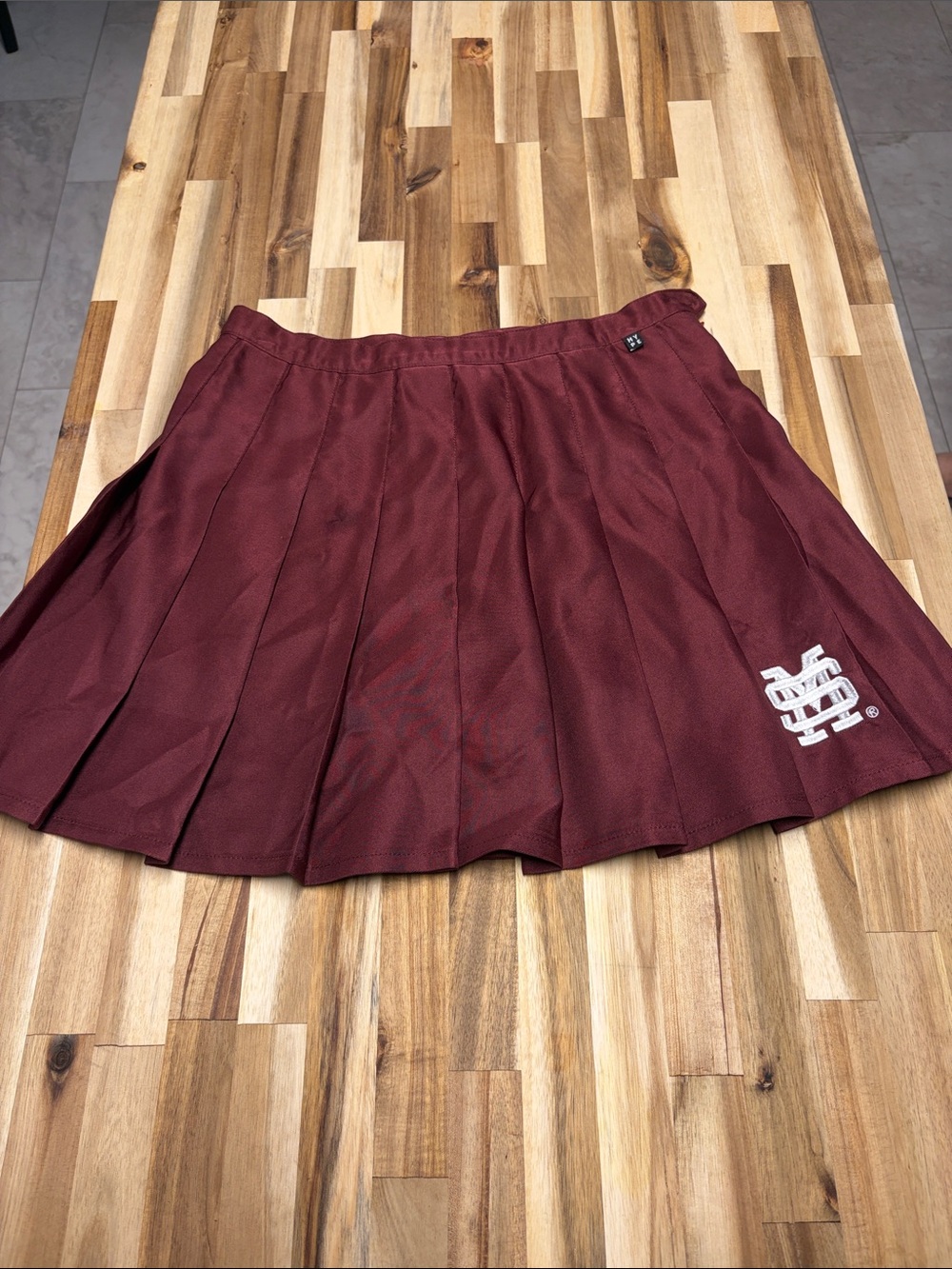 Mississippi State University Women’s Pleated Maroon Mini Skirt w/baseball logo
